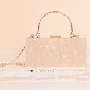ASOS DESIGN marble clutch bag with metal handle